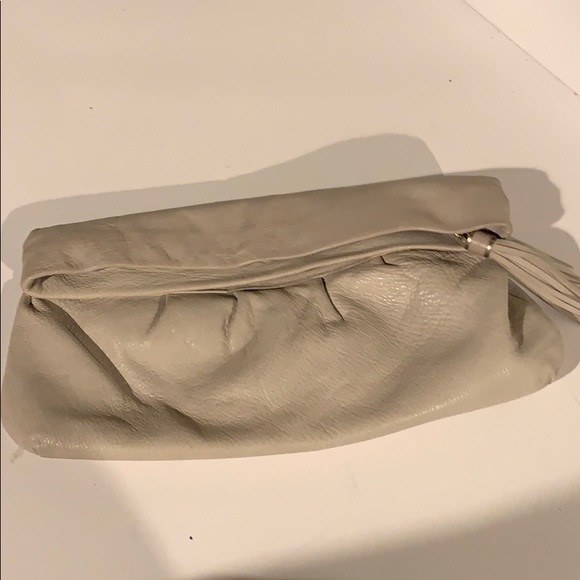 Banana Republic Handbags - Bone leather slouchy clutch with tassel zipper Banana Republic Handbags - Bone leather slouchy clutch with tassel zipper